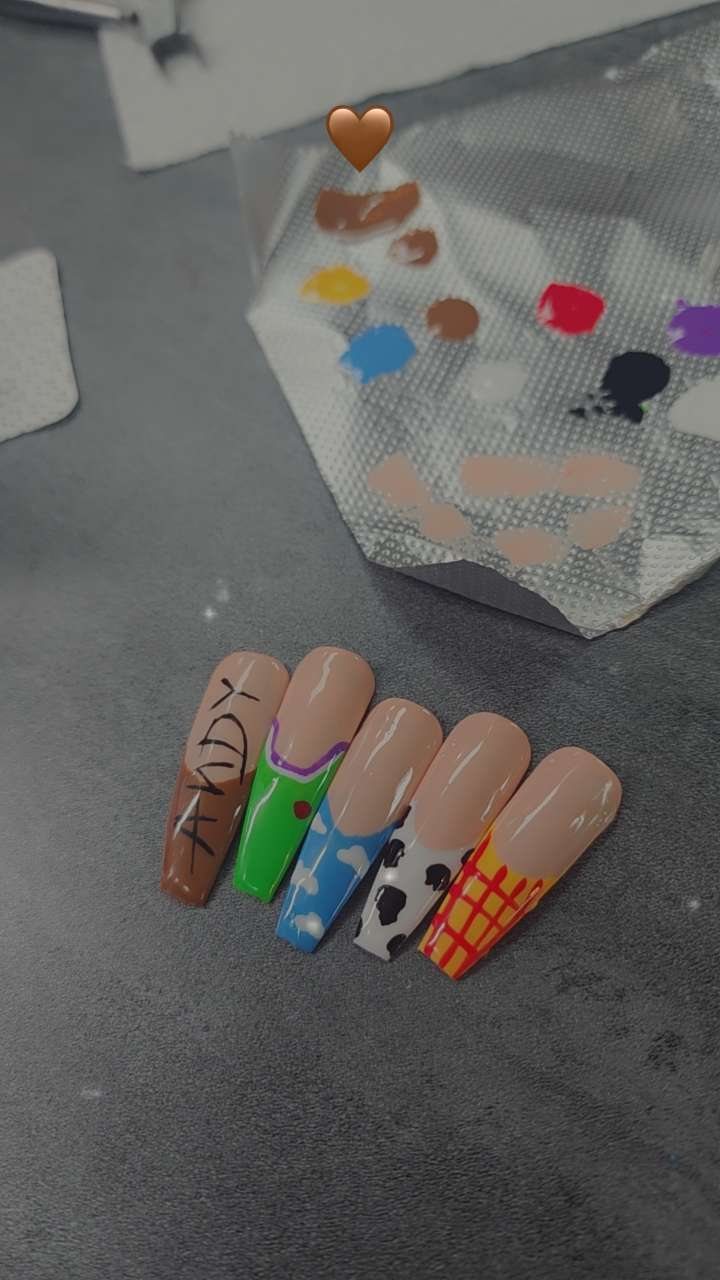 A custom set being hand painted next to her paint palette