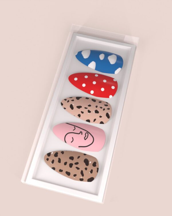 White box with five hand painted press-on nails: clouds, polka dots, cheetah print and line art